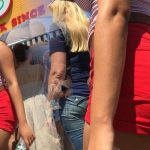 Bouncy and braless Latina with bright red wedgie shorts