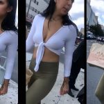 Beautiful woman showing her bust with white shirt