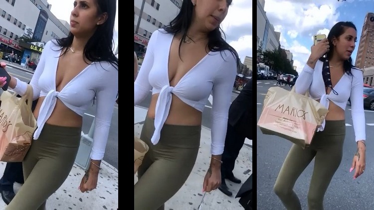 Beautiful woman showing her bust with white shirt