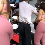 Sexy Brunette Saleswoman in Tight Pink Spandex Outfit